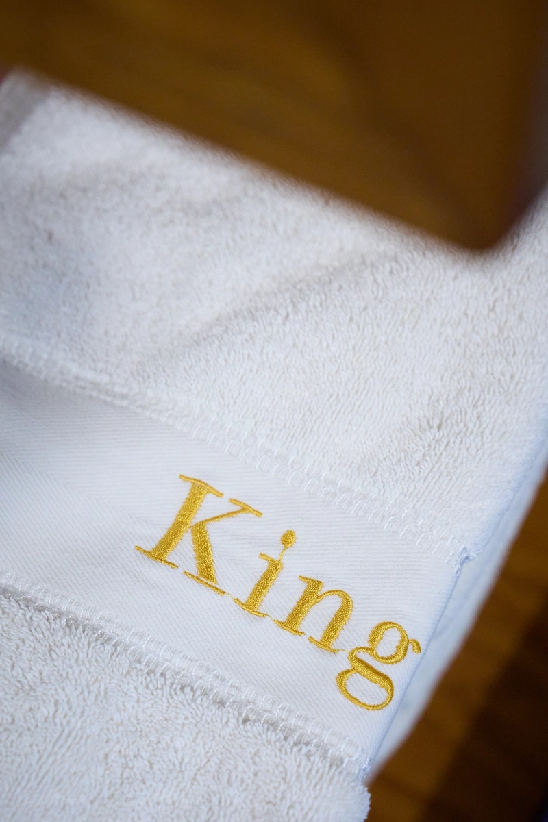 Towel embroidered with King